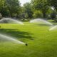 lush green lawn with active sprinkler system irrigation in Overland Park KS